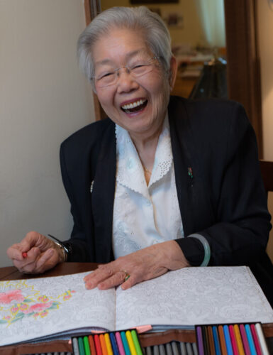 woman coloring and laughing
