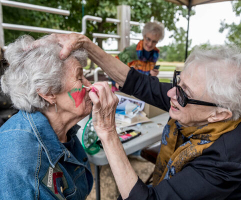 woman getting face painted