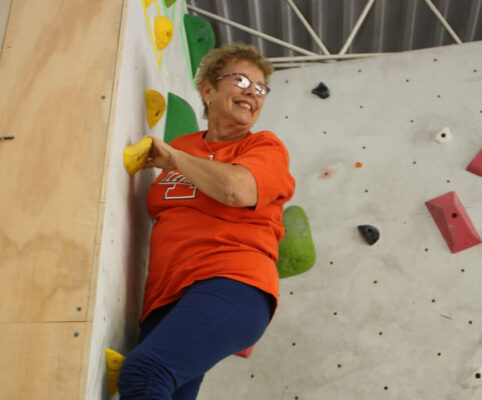 senior woman rock climbing